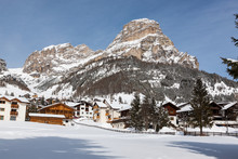 View Of Colfosco, A Mountain Village And Ski Area In The Italian Dolomites, With Snow