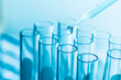 © Tawanboonnak - science research concept,Dropping chemical liquid to test tube,