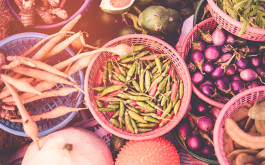 Thai exotic food in street food market with vegetable and fruit. Like the charming people, exotic foods greets you on almost every corner in Thailand. with vintage filter