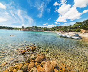 Wall Mural - rubber boat in a small cove in Sardinia