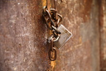 Lock/ Padlock Hanging On A Door