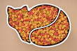 cat food in ceramic bowl on brown paper background