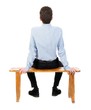 © ghoststone - back view of business man sitting on chair.  businessman watching. Rear view people collection.  backside view of person.  Isolated over white background. Businessman resting on a wooden bench