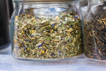 Jars Of Loose Dried Tea Leaves And Flowers