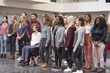 © Monkey Business - Student group standing in university atrium looking away
