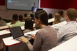 © Monkey Business - Adult student using laptop computer at a university lecture
