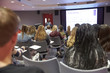 © Monkey Business - Student lecture in modern university classroom, back view