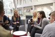 © Monkey Business - Students meeting in the foyer of modern university building
