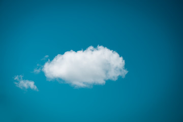 Wall Mural - single white cloud on blue sky