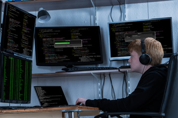 Wall Mural - Boy Stealing Data From Multiple Computers