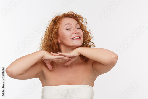 Fotografie, Obraz Picture of playing mature or middle aged woman expressing positive emotions isolated on white background