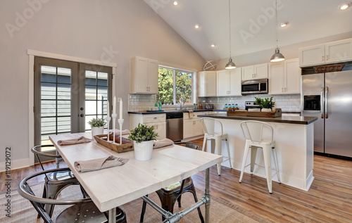 Interior Of Kitchen And Dining Room With High Vaulted Ceiling