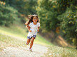 © BalanceFormCreative - Little girl running through the park.
