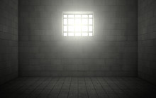 Prison Cell With Light Shining Through A Barred Window
