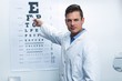 © WavebreakMediaMicro - Optometrist pointing at eye chart