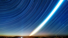 Star Trails On Blue Night Sky