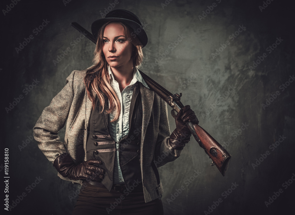 Lady with shotgun and hat from wild west on dark background. - obrazy, fototapety, plakaty 