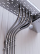Metal pipes with flexible part and cable tray inlet