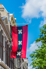 Wall Mural - Flag in Amsterdam streets, Netherlands.