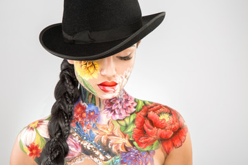 Body art model at gray background