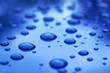 water drops on blue car body threated with protective coating