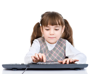 Fototapete - young girl typing keyboard. isolated on white background