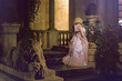Victorian lady. Young woman in eighteenth century image posing in vintage exterior