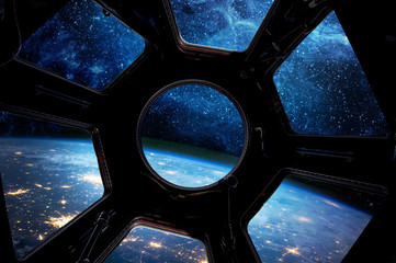 Wall Mural - earth and star in spaceship window porthole. elements of this image furnished by nasa