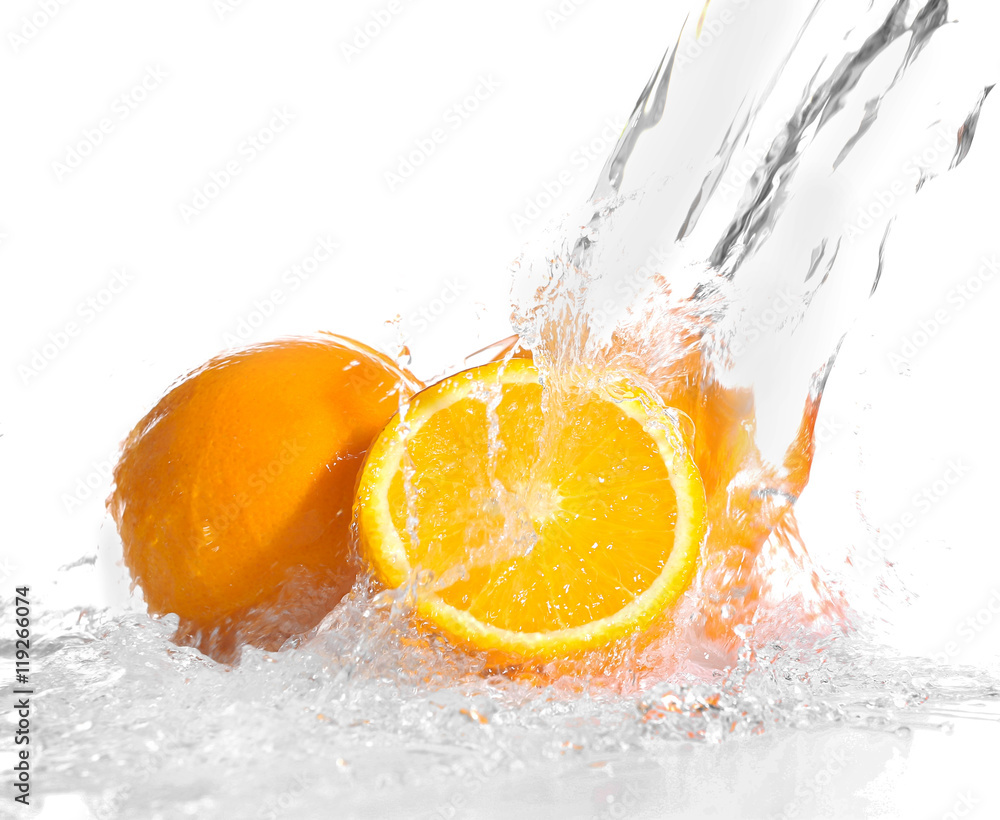 Fresh oranges in splashing water isolated on white