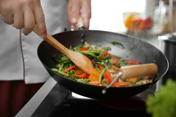 Poster - Mixing vegetables in pan closeup