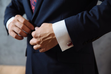 Wall Mural - Businessman hands with cufflinks. Elegant gentleman clother