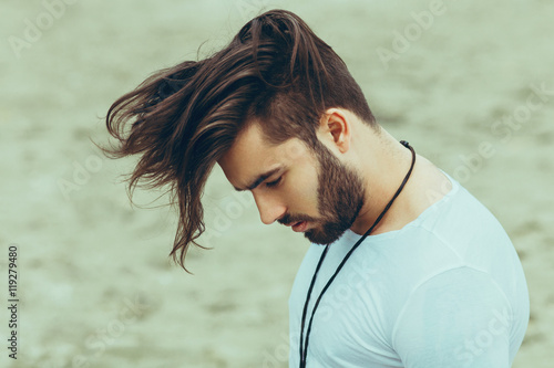 Obraz na plátně Portrait of a man with beard and modern hairstyle