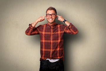 Wall Mural - Young man in shirt and jeans smiling