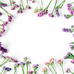 Wall Mural - frame with dried flowers on white background. autumn flat lay wallpaper, top view