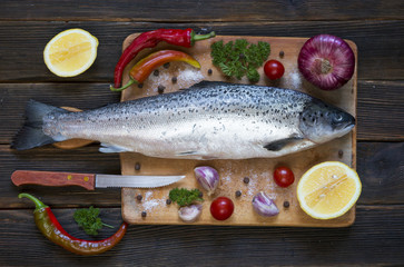 Wall Mural - Cooking background, fish on the blackboard, top view