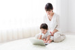 © taka - asian baby and mother using laptop in the room