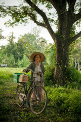 Wall Mural - Grandmother on bikes at the country side