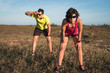 © Starstuff - Tired man and woman outside after long trail running workout exercise. Runner couple resting while running training for a triathlon competition.