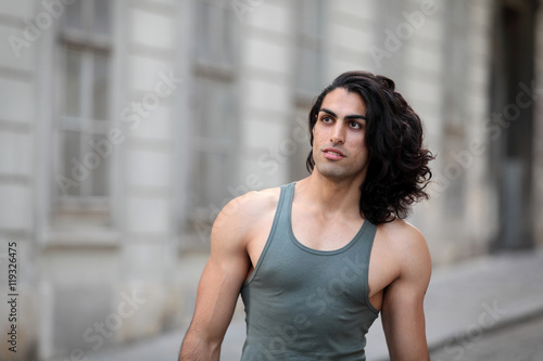 Handsome Man With Long Curly Hair On The Street Buy This Stock