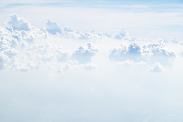 Wall Mural - Aerial view of cloud and sky from airplane,Traveling concept