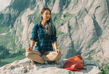 Poster - Hiker sitting in pose of lotos