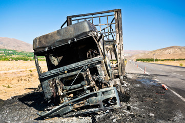 Burned truck waiting on road