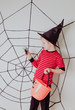 © nadezhda1906 - little boy with spider and web at halloween party