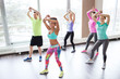 © Syda Productions - group of smiling people dancing in gym or studio