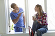 © Johnér - Young couple painting windows, Stockholm, Sweden