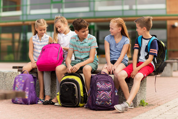 Canvas Print - group of happy elementary school students talking