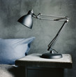 © Johnér - A lamp on a bedside table.