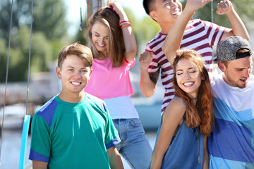 Wall Mural - Young people hanging out on yacht