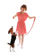© Africa Studio - Young woman walking dog isolated on white