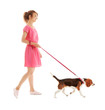 © Africa Studio - Young woman walking dog isolated on white